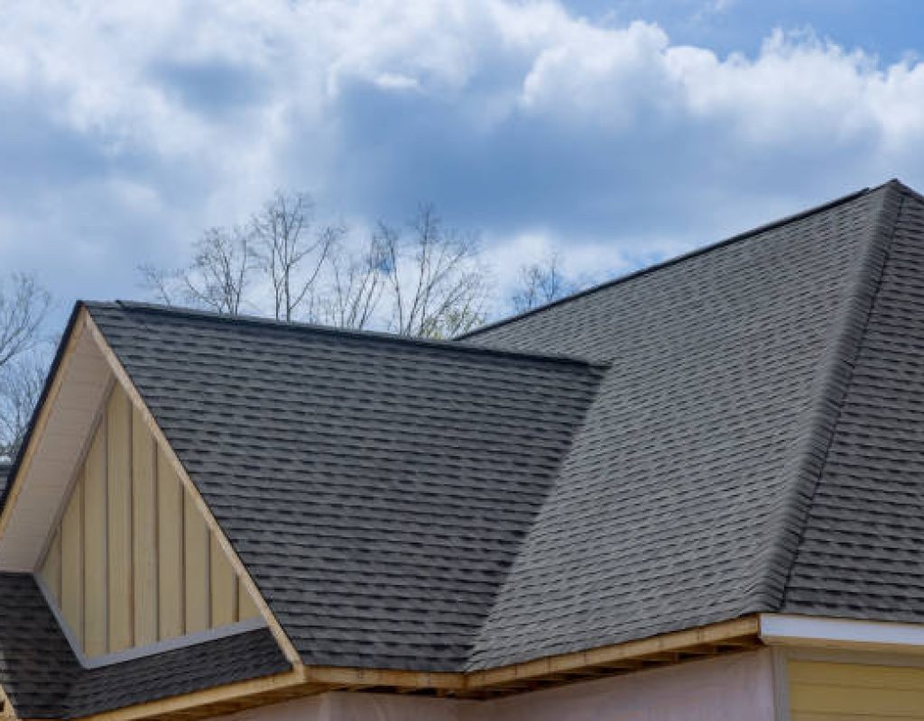 Dave Adams Roofing crew installing wind-resistant flashing in Wildwood, NJ